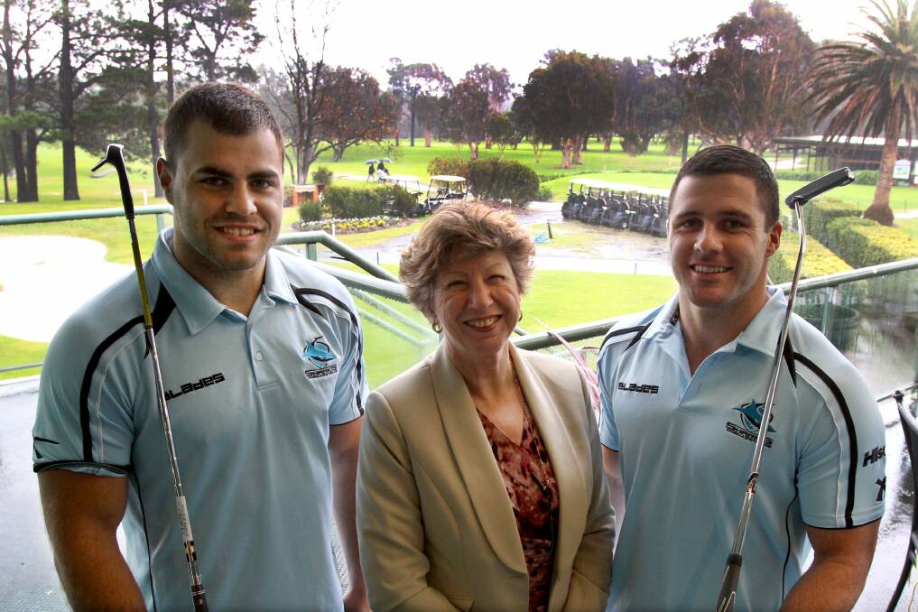 Hole in one: Cronulla Golf Club general manager Jenny Hawkins and Sharks players Wade Graham (left) and Michael Gordon are supporting medical research. Picture: Lisa McMahon