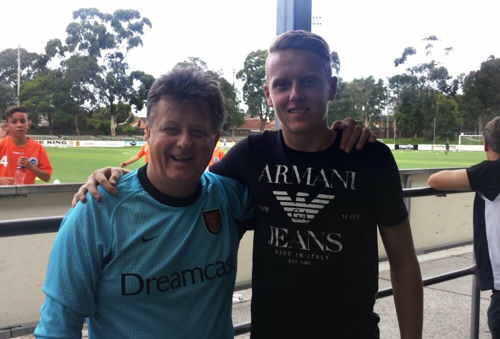 Giant youngster: Tommy Glover (right) with Sutherland Sharks goalkeeping coach Ron Tilsed at Seymour Shaw Park, Miranda.