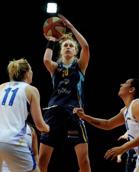 Jumping for Joy: Sutherland's Michelle Joy (left) in action for Sydney Uni Flames. Picture: Colleen Petch
