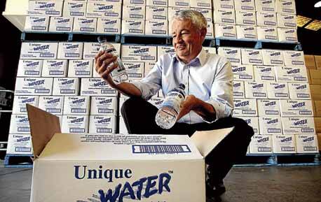 Bold claims: Inventor Russell Beckett came up with the idea to create a magnesium-rich water 10 years ago. Top left, the Leader story that ran in 2002 about the queues when Unique Water first hit the market. Picture: Jane Dyson 