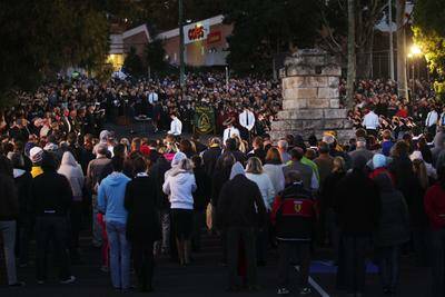 Lest we forget: Crowds gather for the dawn service at Miranda (above) and Caringbah (below). Pictures John Veage