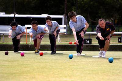 A new hope: Bowls buff Dave Jones (right) teaches Sydney Technical High School students Filip Drazovic, Ben Avirame, Gus Lauder-Elix and Alex Baehnisch the game of bowls. Picture: Lisa McMahon 