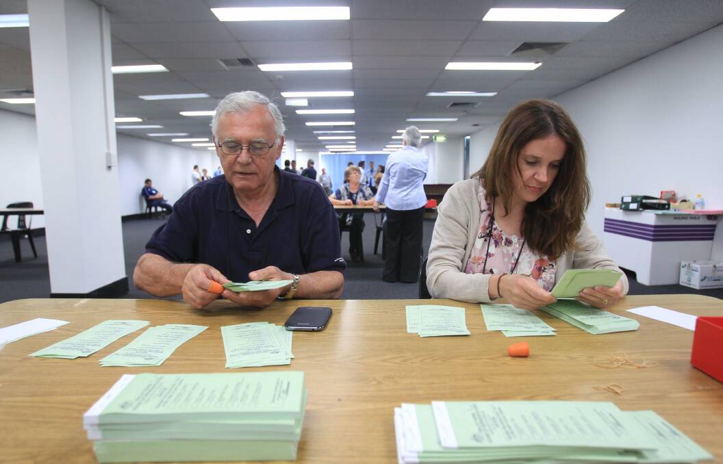 "Cliff-hanger": Pandechis Elias (left) and Josie Vecchio recount votes in the seat of Barton. Picture:  Chris Lane