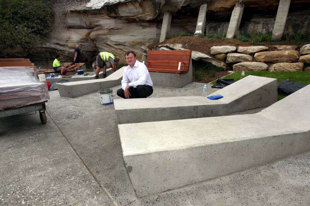 Skateboard outrage: Mayor Kent Johns inspects the sun lounges. Picture: Lisa McMahon