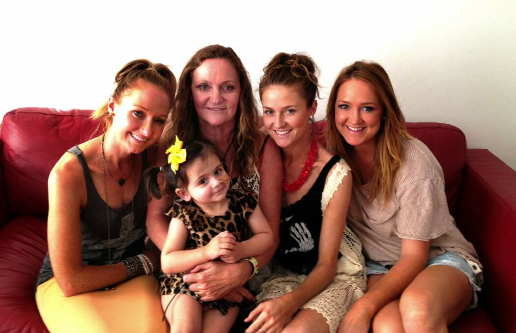 An ‘‘emotional’’ time:  The Purcell family (from left) Brigitte, mum Debbie, Georgia and Olivia with little Lulu.