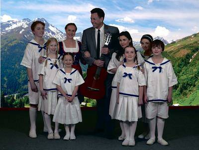 The hills are alive: Captain Von Trapp and his family in The Sound of Music. Back (from left) Gus Noakes (Friedrich), Lynley Fuller (Maria), Mark Gardner (Captain von Trapp); centre: Alexis Hutchinson (Brigitta), Stephanie-Kate Bratton (Leisl), Melissa Donnelly (Louisa); front: Bella Thomas (Gretl), Phoebe Vinciguerra (Marta) and Jordan Fuller (Kurt). Picture: Peter Kingsley