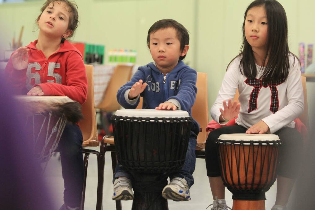 A fun time: Children in a samba drumming workshop at Caringbah vacation care. Picture: Chris Lane