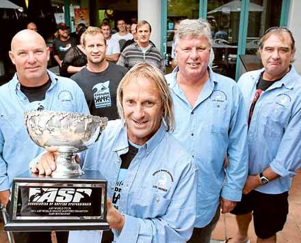 Prodigal son: Cronulla mates such as (from left, rear) Richard Maurer, Cameron Johnston, Barry Tyte and Mark Henderson gathered on Saturday when Iain "Ratso" Buchanan (front) got life membership after winning the world masters surfing title. Picture: John Veage
