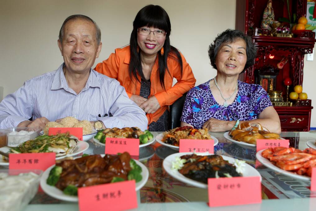 Preparation for New Year:  Cantonese and Mandarin celebrations will commence at the end of January. Picture: Jane DysonChoi Kuan and Sandy Sun and daughter Annie So