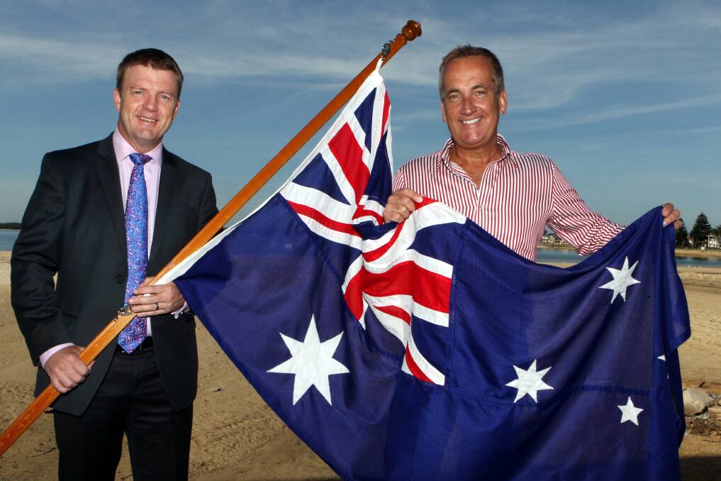 Flying the flag: Radio and TV announcer Glenn Wheeler will be MC for Rockdale's Australia Day celebrations. He joins Rockdale mayor Shane O'Brien (left) on the shores of Botany Bay to get into the swing of things. Picture: Jane Dyson