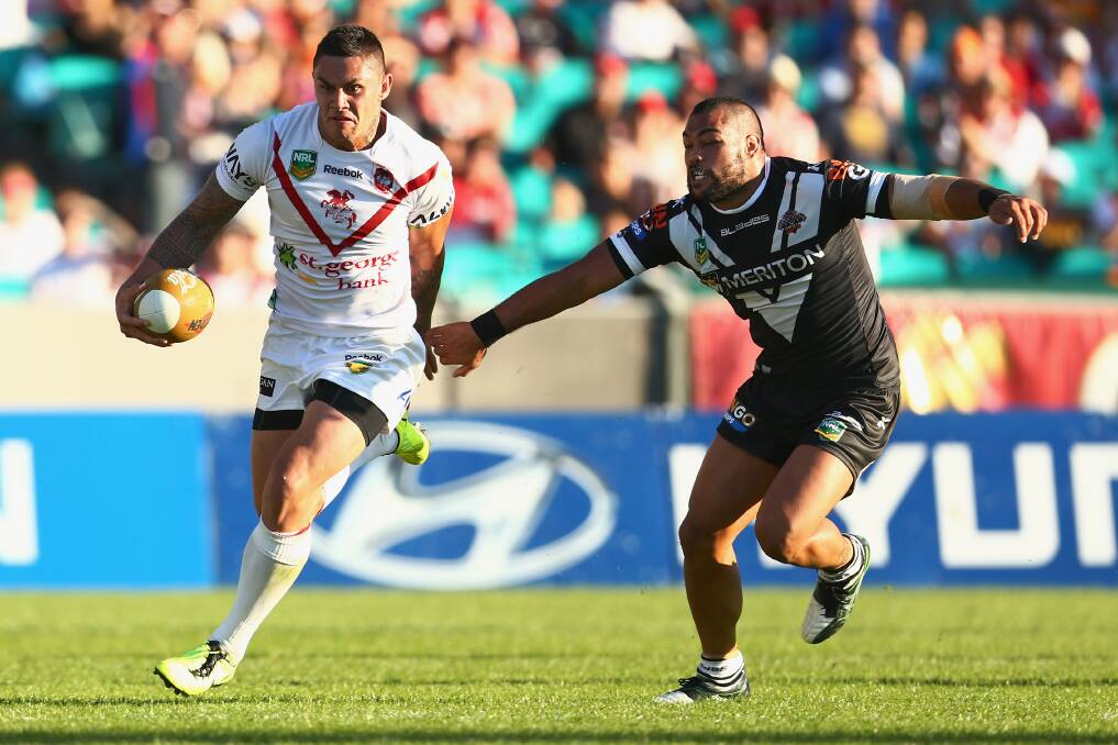 Catch me if you can: Dragons winger Daniel Vidot is chased by Wests Tigers’ Adam Blair in their first round clash earlier this year at the Sydney Cricket Ground. The Dragons won 13-12. Picture: Mark Kolbe, Getty Images