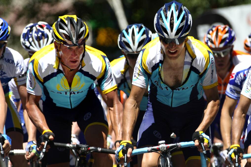 Stripped of titles: Lance Armstrong (left) in the Tour Down Under. Picture: John Veage