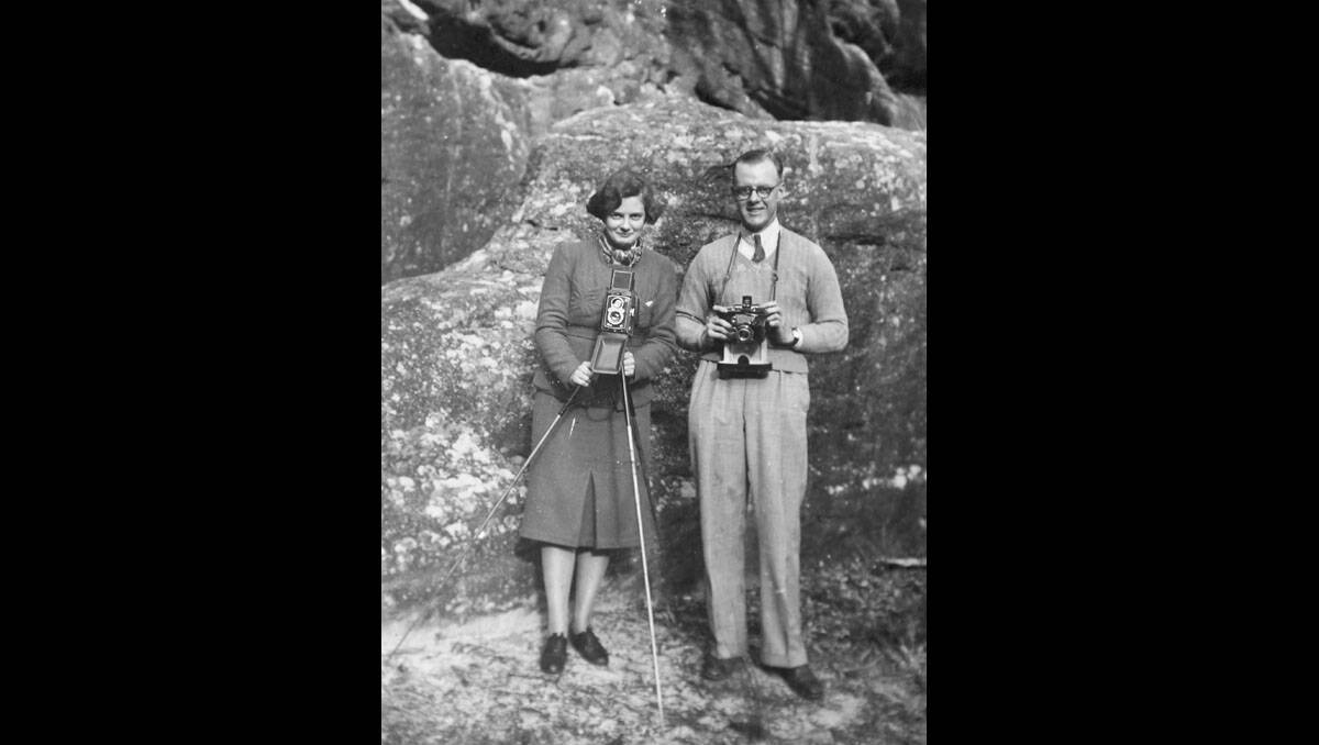 Mabel with her Roleiflex and John with his Exacta SLR