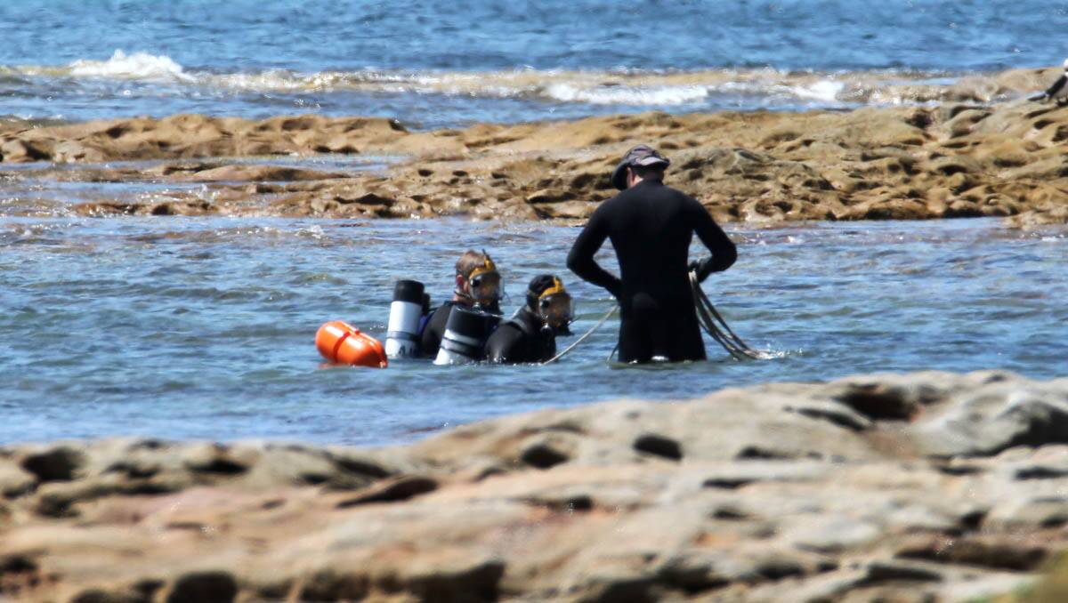 Still investigating: Police and divers at Cook’s Landing Place, Kurnell are investigating after a woman died there Monday morning. Pictures: John Veage
