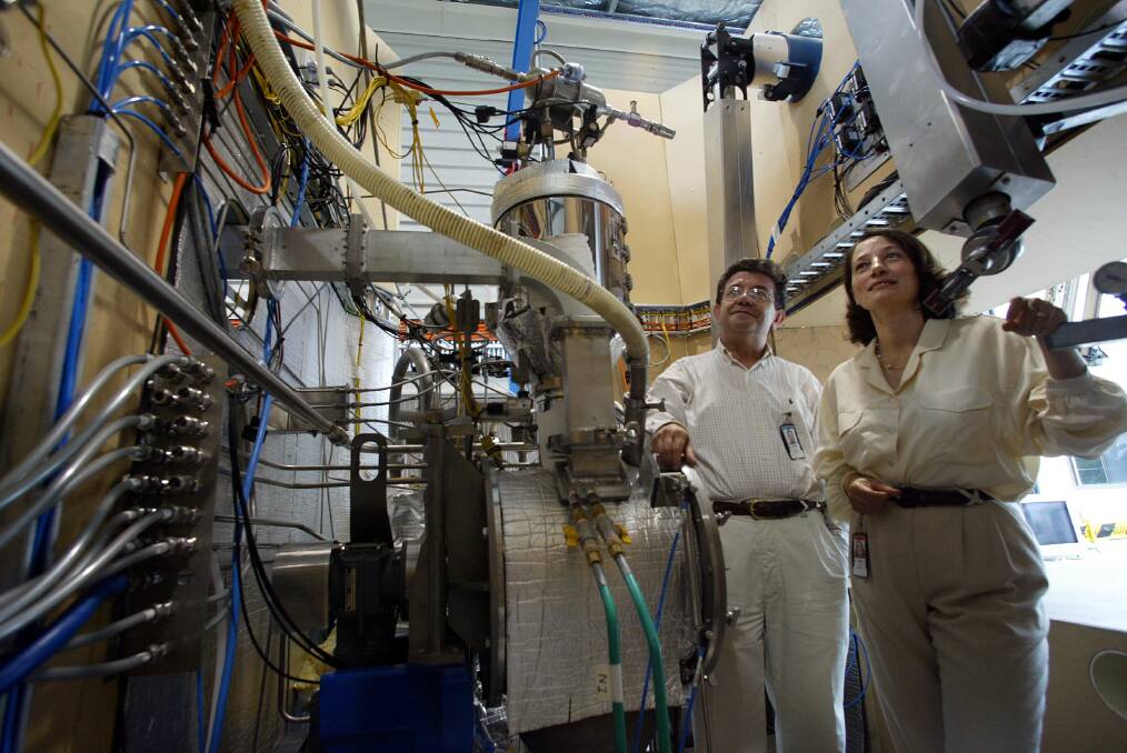 Team work: Turkish-born scientists and husband and wife team, Dr Erden Sizget (left) and Dr Devlet Sizget are pictured at Lucas Heights, ANSTO in April 2006, working on a mock-up of the Synroc plant. Picture: Robet Pearce.