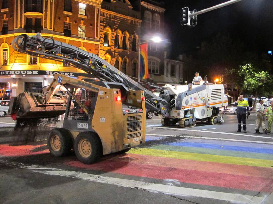 Going, going: The rainbow crossing being removed. Picture: Ross Duncan