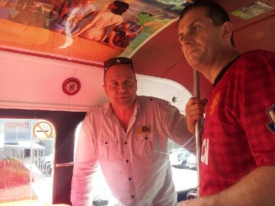 In charge: Club President Mark O'Connor with bus driver and former British Commando Simon Reynolds (left).