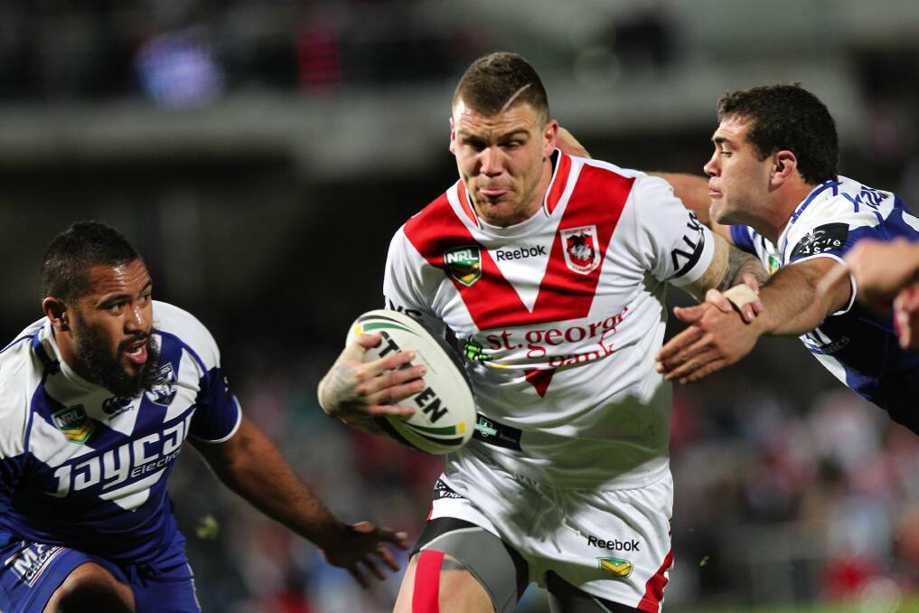 Leading the pack: Josh Dugan scores in a game against Bulldogs at Kogarah Oval in August. Picture: John Veage