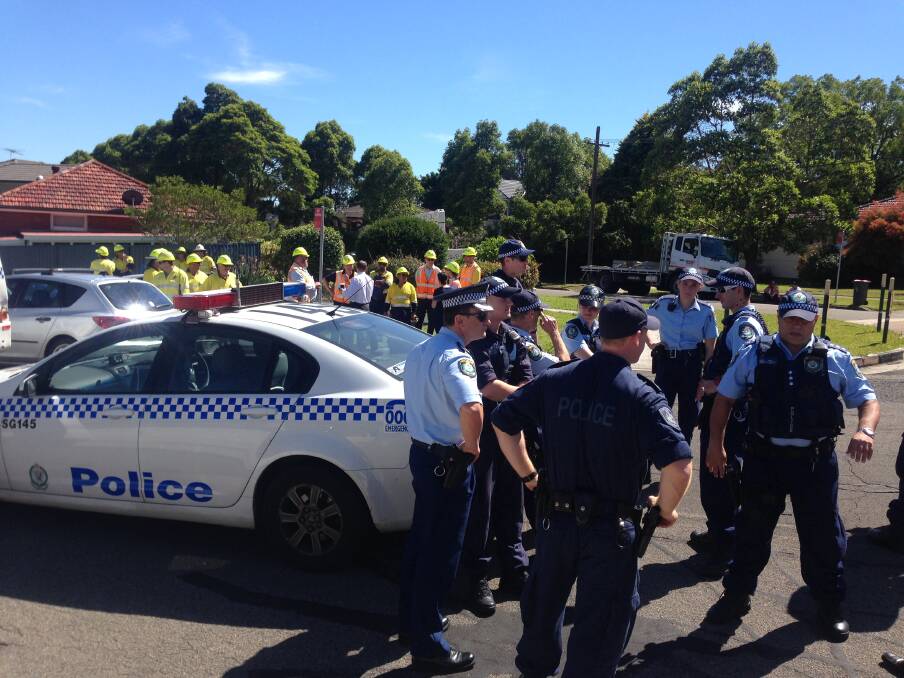 Determined: Police speak to protestors at the site this morning. Picture: Jane Dyson