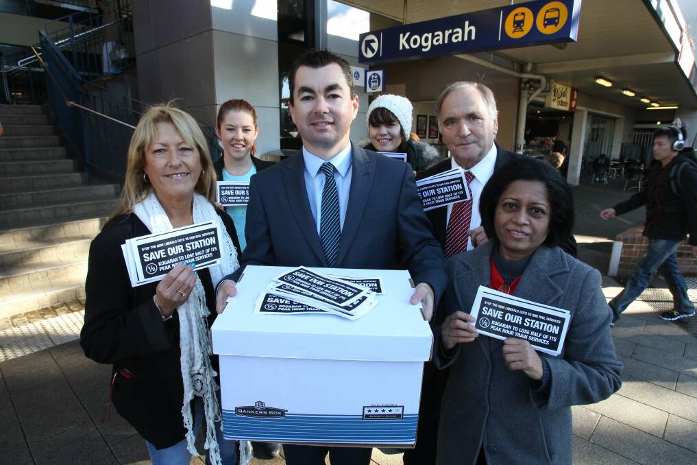 Rail rage: A delegation, led by Steve McMahon, takes a petition to Parliament House, protesting against proposed service cuts for Kogarah station. Picture: Jane Dyson