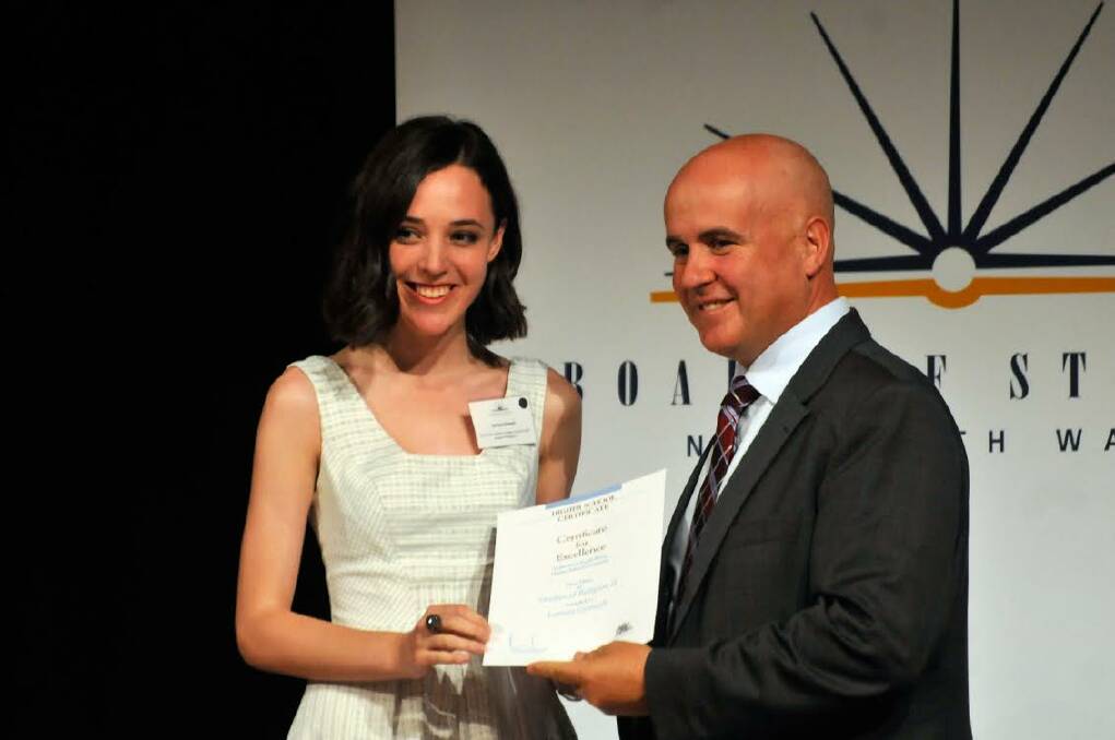 High performer: De La Salle Senior College Cronulla student, Larissa Grinsell, got an ATAR of 99.6 today. The high achiever also came first in NSW for studies of religion 2.  She was one of seven students from St George and Sutherland Shire schools to be presented with a First in Course award from Education Minister, Adrian Piccoli. Picture: supplied