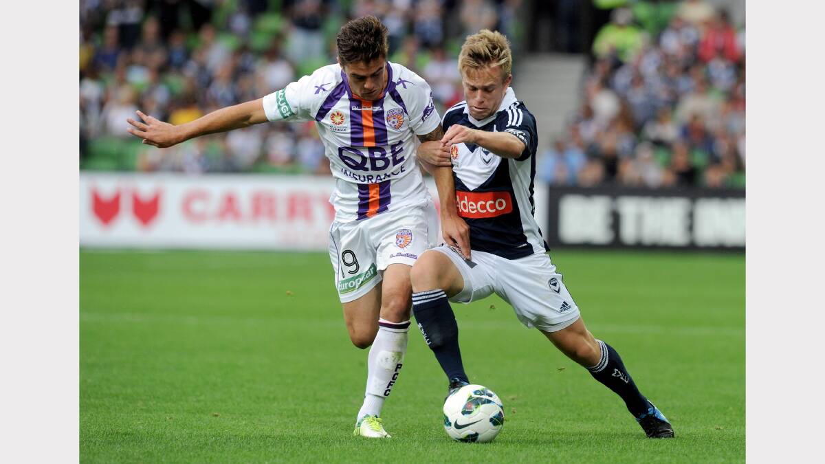 On the ball: Melbourne Victory's Connor Pain (right).