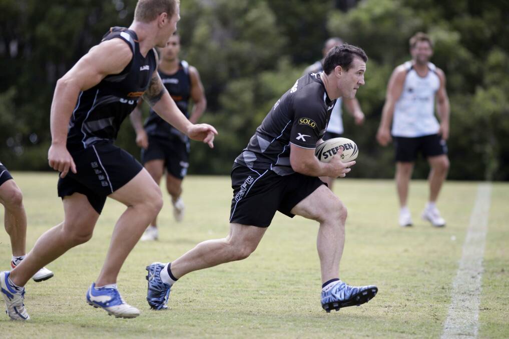 Inspiring:  Sharks experienced rep players, ‘gun’ new buy Luke Lewis (left) and captain Paul Gallen,  lead a training drill. Picture: Anna Warr