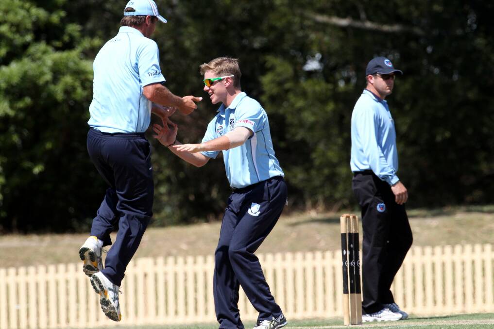 Airborne: Adam Zampa (centre) celebrates with captain Phil Jaques, who took a spectacular early catch off Zampa’s bowling in Sutherland’s win. Picture: Jane Dyson
