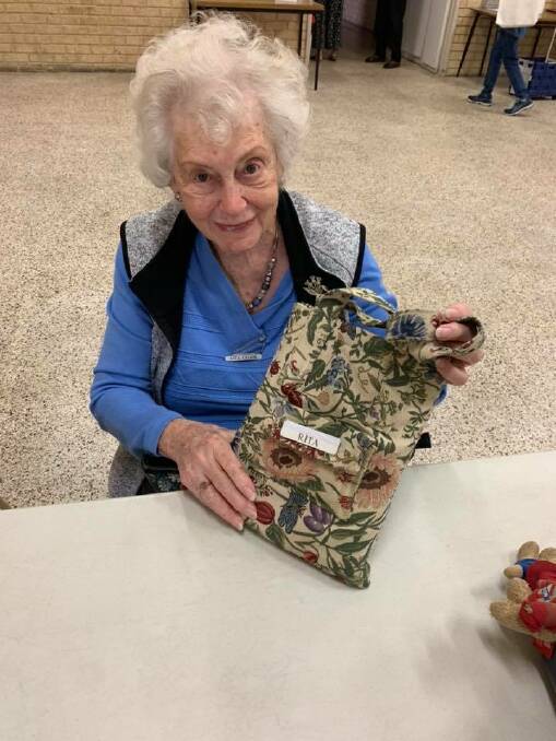 Switched on Seniors Member Rita with the iPad bag she made. Photo: Switched on Seniors Facebook.
