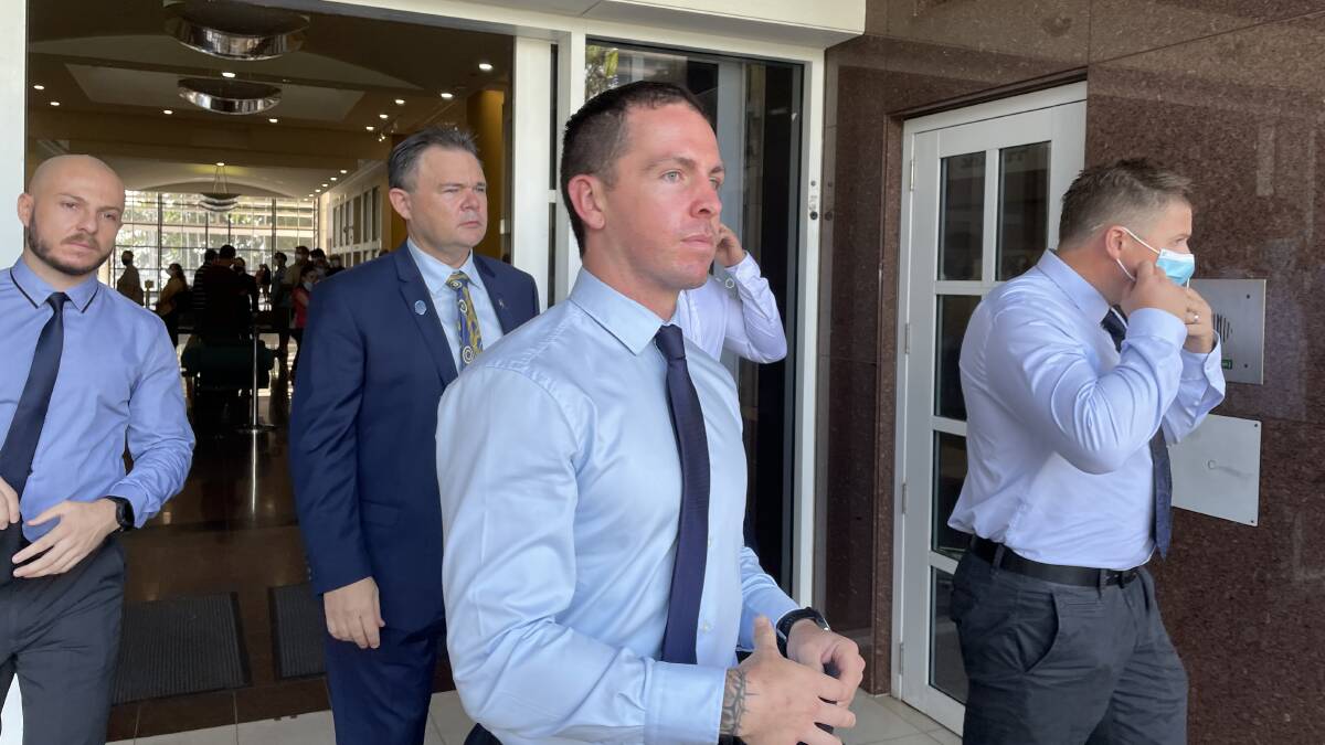 Zachary Rolfe, centre, leaves the Darwin Supreme Court with supporters on the first day of his murder trial. Picture: Sarah Matthews