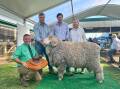 Rick Power, Nutrien, with Charlie, Jono and Pip Merriman, Merrignee, Boorowa, with the overall supreme exhibit. Picture by Rebecca Nadge