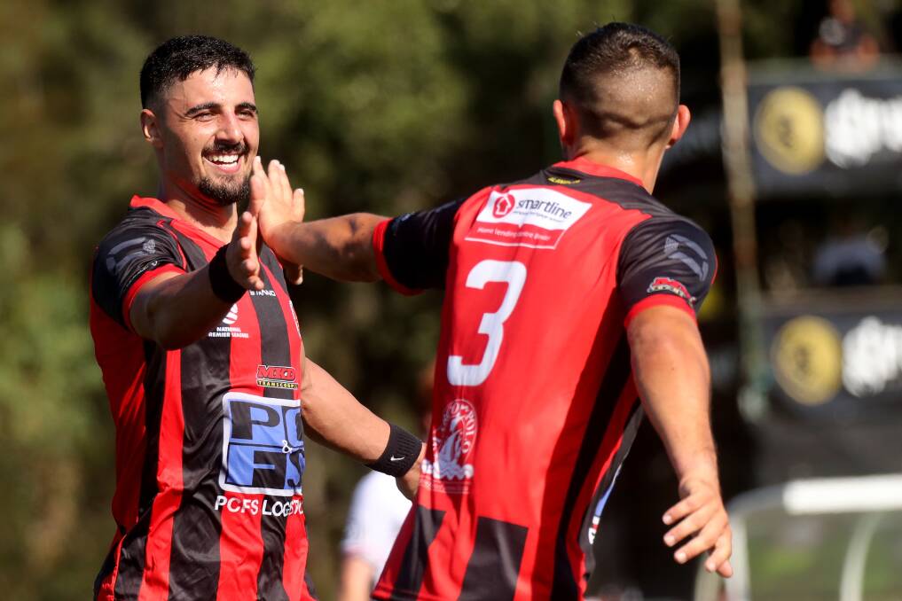 First loss: Rockdale Ilinden FC players celebrate a goal in their round one match against the Wollongong Wolves. Picture: Football NSW.