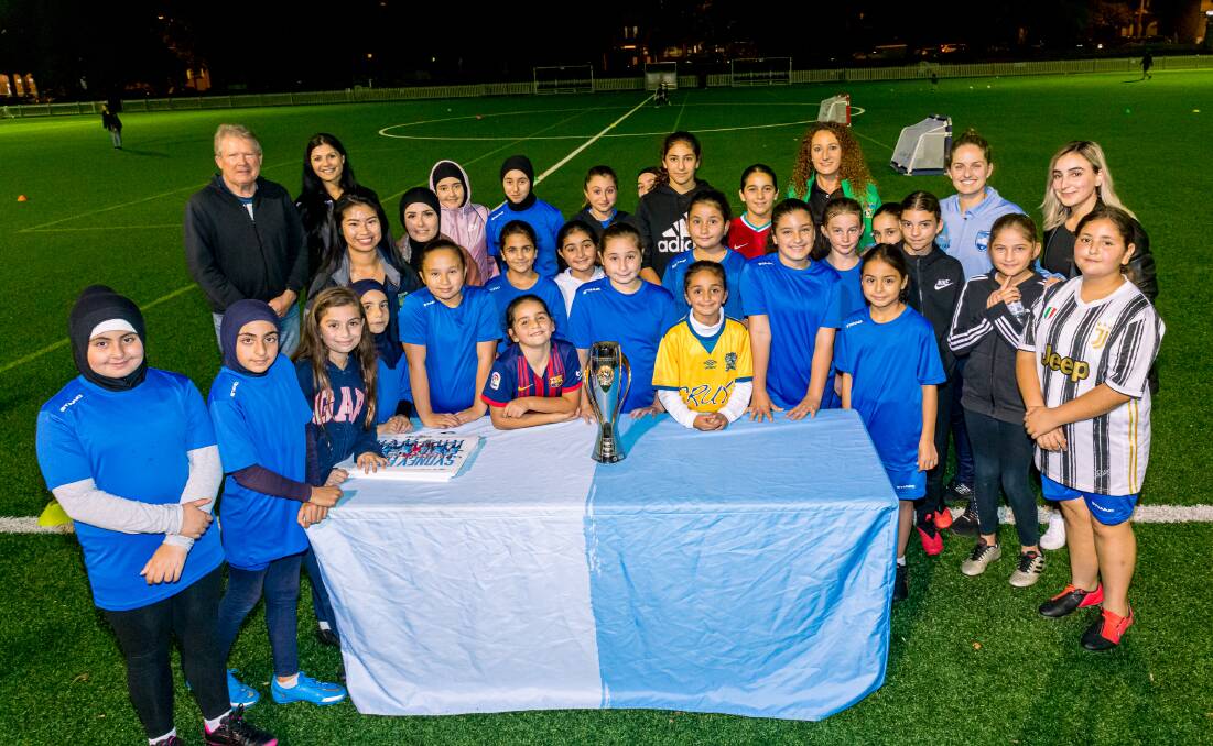 Celebration: The women of Arnclfe Aurora Football Club with special guests, at the club'd Female Football Week event. Picture: Supplied.