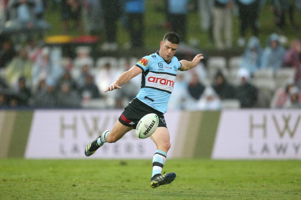 Locked in: Chad Townsend winds up for a kick for the Sharks. Picture: Geoff Jones.