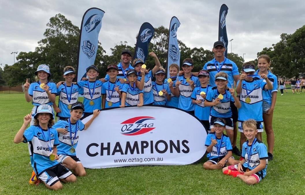 Gold: John Morris (back right) with his son Cruz's Under 11 Sutherland Oztag team after they won the Division Two State Championship at Bass Hill. Picture: Supplied.