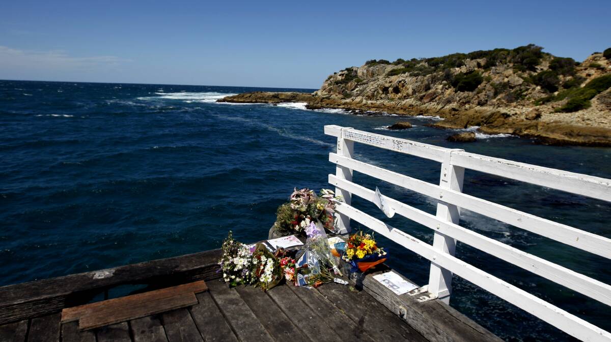TRIBUTE: Flowers are left on the Tathra Wharf in the aftermath of the the November 18, 2008, tragedy that claimed the lives of Shane O'Neill and his two sons. Picture: Fairfax file image