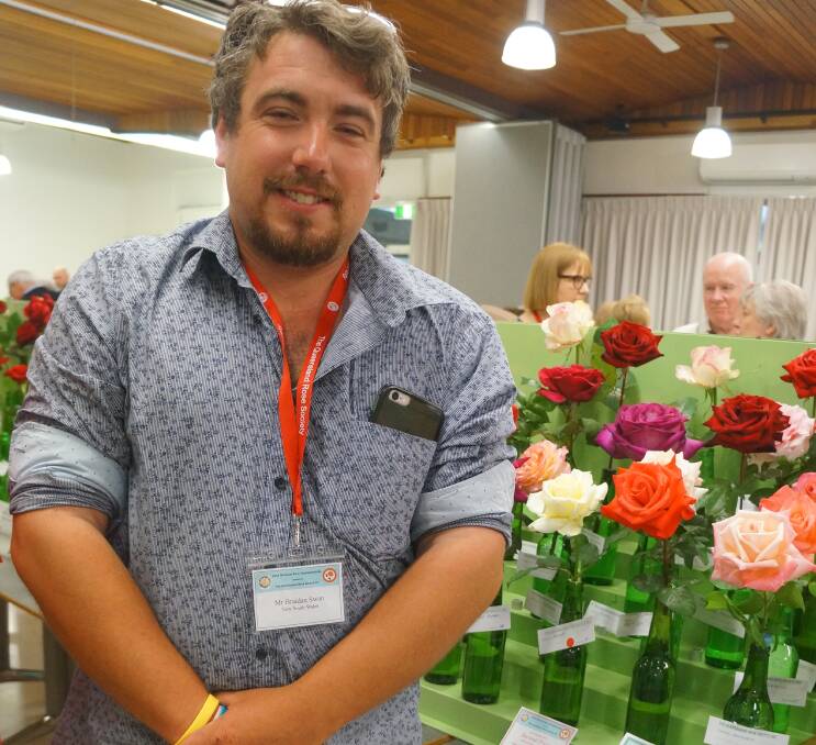 HAPPY DAYS: Braidan Swan with his award-winning rose.