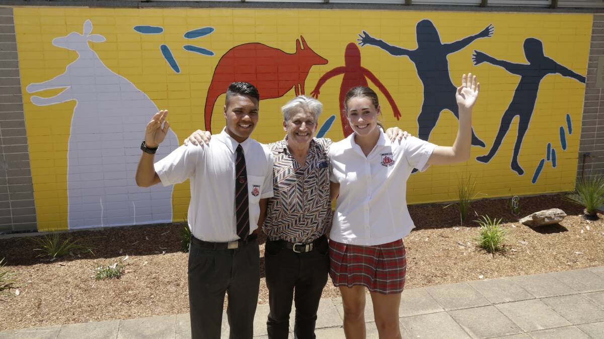 Creative team: (left to right) Darcey Moran, student, Endeavour Sports High School; Rick O’Brien, art teacher, Endeavour Sports High School; and Ella Robinson, student, Endeavour Sports High School, standing in front of the Dharawal Mural.

 