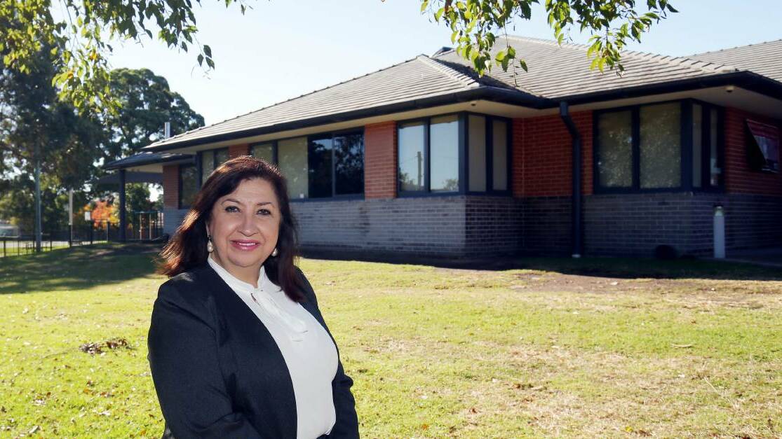 Virtual crossroads: Anne Farah-Hill outside the Kingsgrove Community Aid Centre which is finding new ways of reaching the vulnerable and isolated during the coronavirus pandemic. Picture: John Veage. 