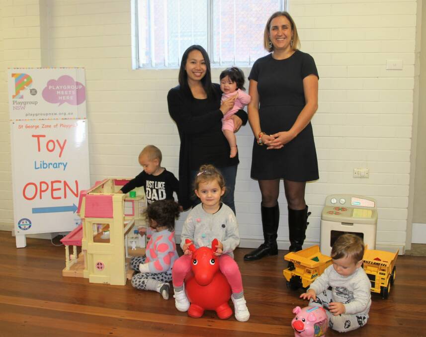 Toy parade: Councillor Sandy Grekas (right) with Mishel Piercy treasurer, St George Zone of Playgroups and children at St George Playgroups Toy Library in Oatley. 