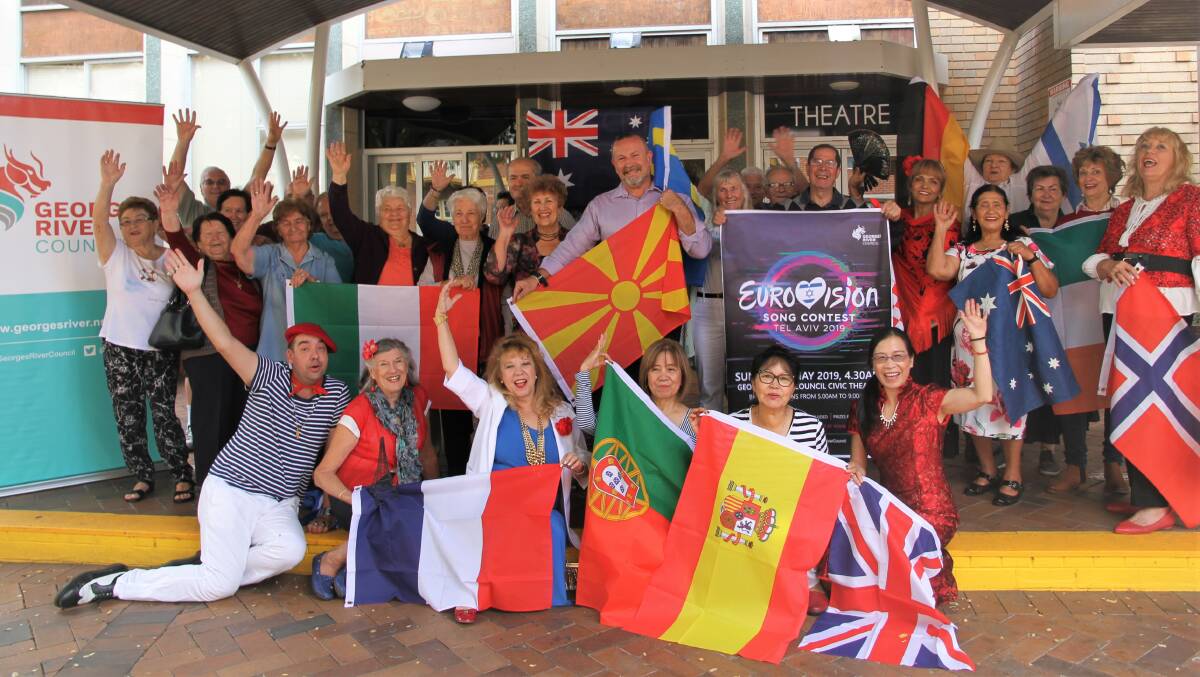 Something to sing about: Councillor Lou Konjarski with Eurovision fans gearing up for the live broadcast at the Hurstville Civic Centre.