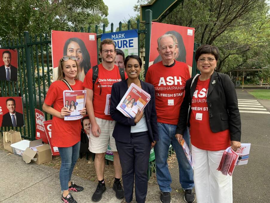 Labor's Ash Ambihaipahar wth supporters at Mortdale.