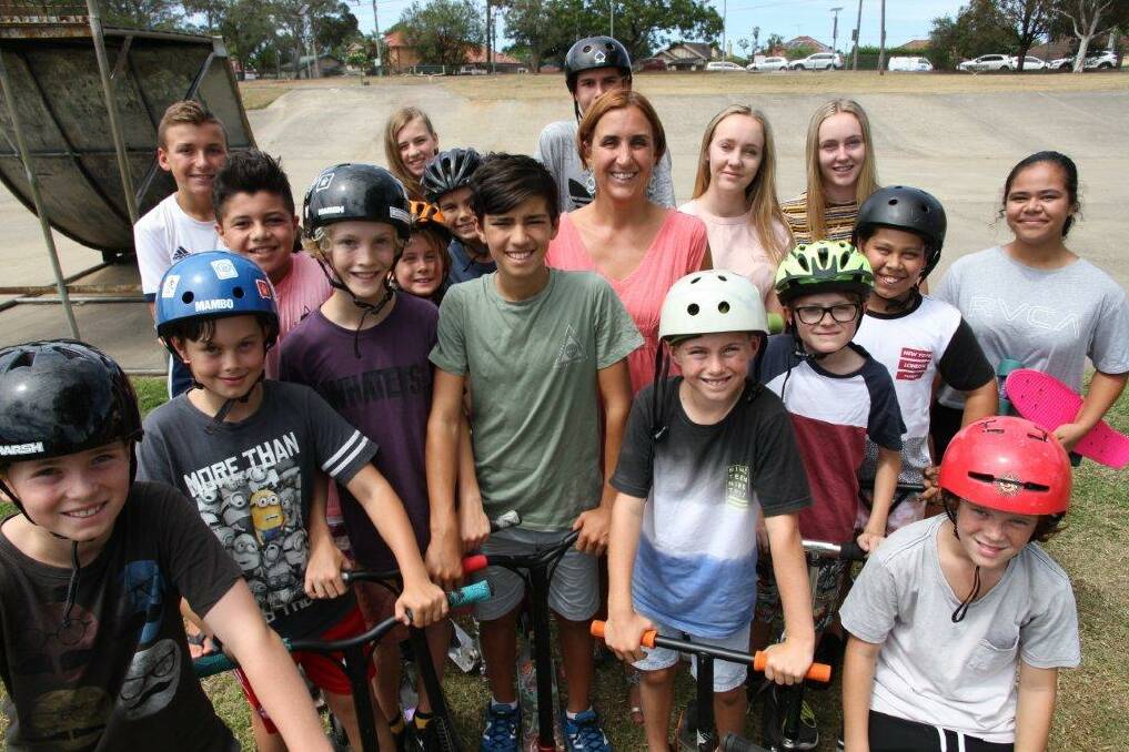 Councillor Sandy Gekas, centre, pictured in 2018 with local youth at the Olds Park skate ramp.