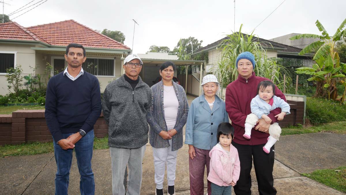 Homes lost: Webb Street property owners EVineh Charan (left), his parents Sam and Monika, and Gan Yin, Zhuo Xing, with children Zhi Li and Zhi Wen. Picture: Chris Lane
