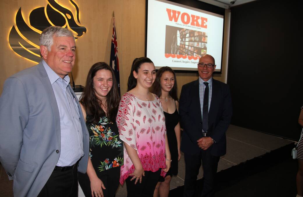 Georges River Council Mayor Kevin Greene with the Knijnik triplets, Luiza, Juliana
and Marina with Caringbah High principal Alan Maclean at the launch of the online magazine Woke.