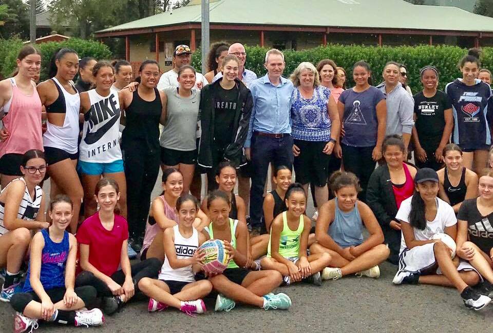 Federal member for Banks, David Coleman, centre with members of the St George Netball Association at the Rockdale courts for the funding announcment.