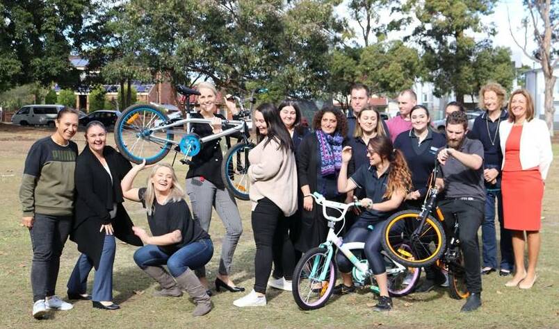 Wheel good fun: Ramsgate RSL Club staff with the three bikes they buillt for children to use at the Bayside Women's Shelter.