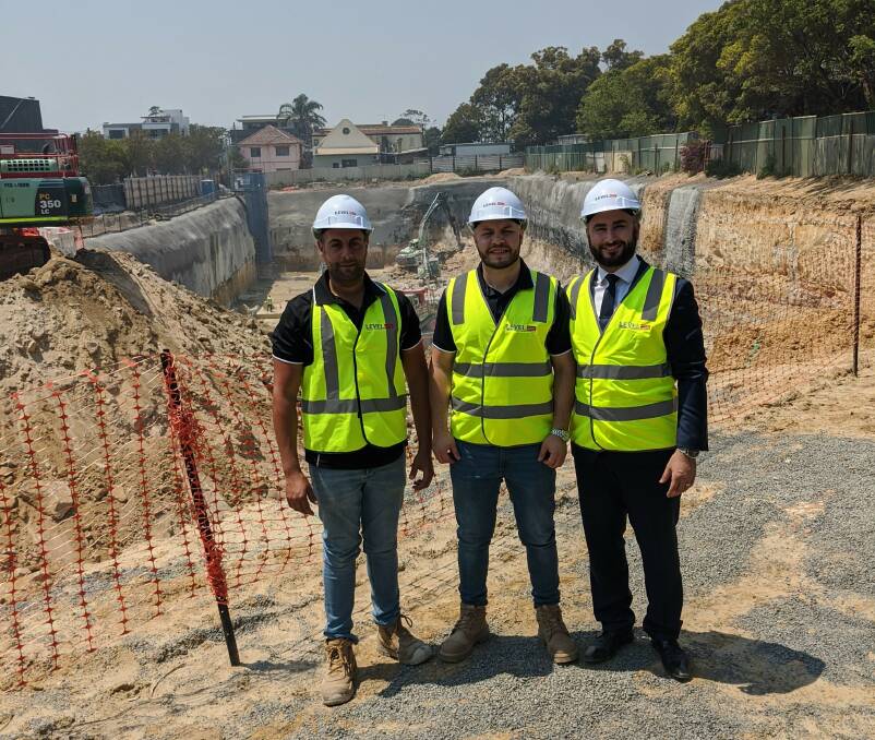 St Trinity Group's Sales Director Will Wehbe (right) with the Level 33 construction team at the Kogarah Central site.