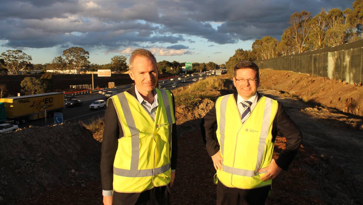 Work underway: Banks MP David Coleman and Oatley MP Mark Coure at the Belmore Road Ramps construction site last Friday.