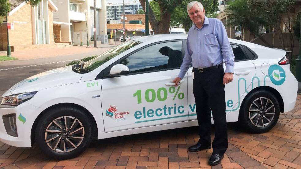 Georges River Council mayor Kevin Greene takes delivery of one of the council's new electric cars in March this year.